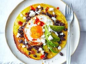 Egg, beans, and avocado tostada