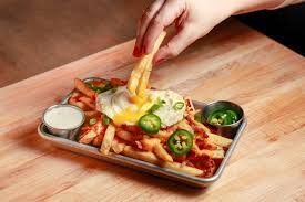 Loaded fries with egg