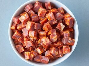 Diced cured meat in bowl