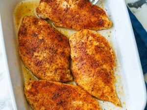 Spicy baked chicken breasts in dish